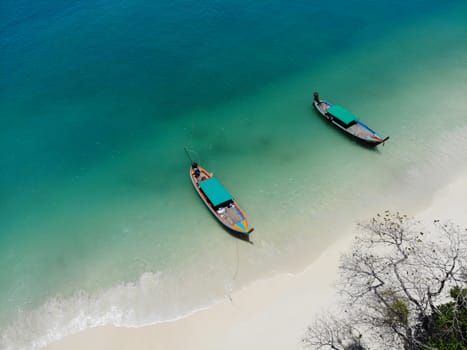 Seascape  wtih boats and white sand  in summer beautiful color in nature background at Southern Thailnad top view by drone