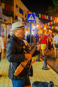 SAFED, ISRAEL - AUGUST 23, 2017: Scene of the Klezmer Festival, with street musicians playing, in Safed (Tzfat), Israel. Its the 30th annual traditional Jewish festival in the public streets of Safed