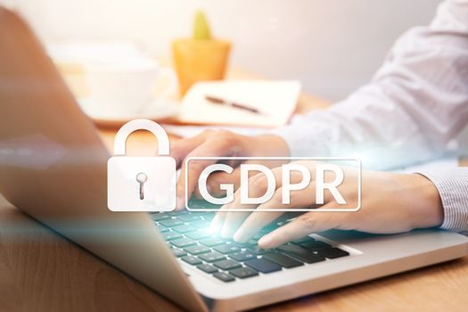 cyber security and privacy concept. people using personal computer with text GDPR or General Data Protection Regulation text secure with a padlock logo.