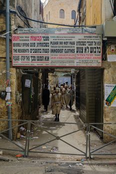 JERUSALEM, ISRAEL - MARCH 25, 2016: Street scene, with local orthodox Jews, in the ultra-orthodox neighborhood Mea Shearim, Jerusalem, Israel