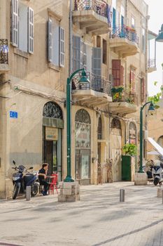 TEL AVIV, ISRAEL - MAY 04, 2013: Street scene with cafe, locals and tourists, in the southern part of Tel Aviv, Israel