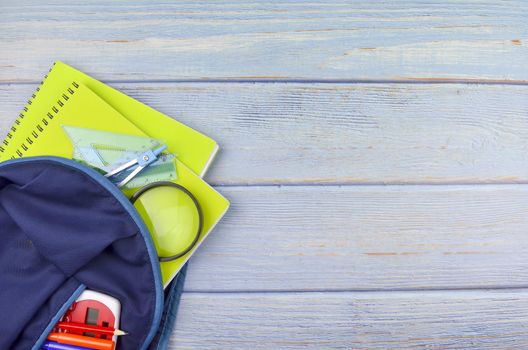 Student backpack and various school supplies, studing, education and back to school concept.