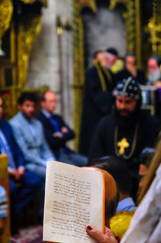 JERUSALEM, ISRAEL - APR 28, 2016: Washing of the Feet ceremony, in the Syrian Orthodox St. Marks church, with the patriarch and community members. Orthodox Holy Thursday in the old city of Jerusalem, Israel