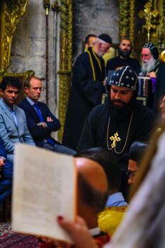 JERUSALEM, ISRAEL - APR 28, 2016: Washing of the Feet ceremony, in the Syrian Orthodox St. Marks church, with the patriarch and community members. Orthodox Holy Thursday in the old city of Jerusalem, Israel