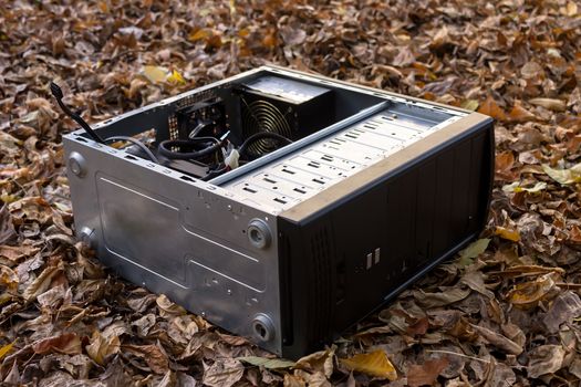 Old and broken computer dumped in a landfill