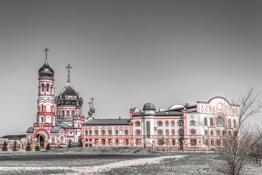 Christian church on the field in gray tones
