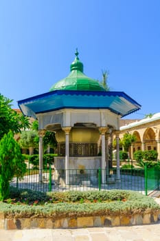 ACRE, ISRAEL - SEPTEMBER 18, 2017: View of the inner yard and sabil of El-Jazzar Mosque (the white mosque) in Acre (Akko), Israel