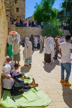 JERUSALEM, ISRAEL - APRIL 29, 2016: A crowd of Ethiopian Pilgrims gather in the Deir Es-Sultan, part of the church of the Holy Sepulcher, in Orthodox Good Friday. The old city of Jerusalem, Israel