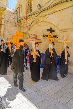 JERUSALEM, ISRAEL - APRIL 29, 2016: An Orthodox Good Friday scene in the yard of the church of the Holy Sepulcher, with pilgrims arriving. The old city of Jerusalem, Israel