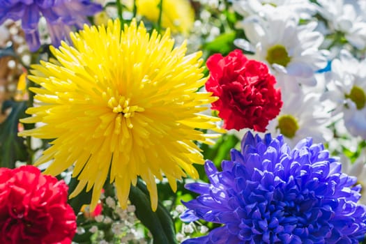 Many bright and beautiful flowers collected in a large bouquet