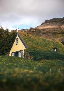 Historic turf Church Hofskirkja in the small icelandic village of Hof, Iceland