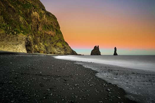The black sand beach of Reynisfjara and the mount Reynisfjall near the village of Vik in south Iceland. Long exposure.