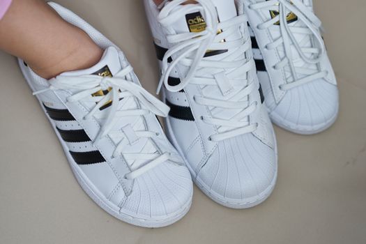 Bangkok ,Thailand,July 18 ,2018-Three white sneaker shoes brand Adidas