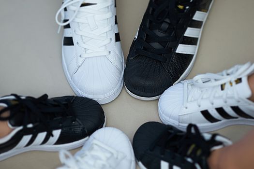 Bangkok,Thailand,July 18,2018-Pairs of black and white color sneaker adidas shoes in three  sizes.jpg