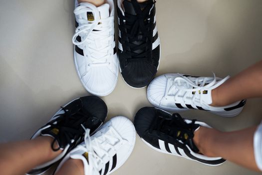 Bangkok,Thailand,July 18,2018-Pairs of black and white color sneaker adidas shoes in three sizes.jpg