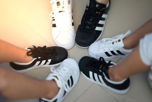 Bangkok,Thailand,July 18,2018-Pairs of black and white color sneaker adidas shoes in vary sizes.jpg