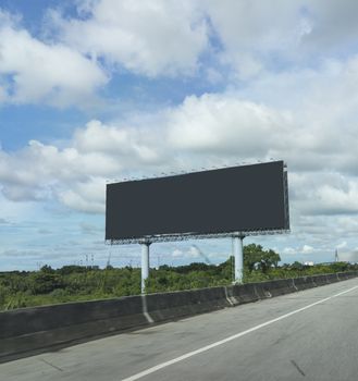 black blank billboards or advertising poster on side of express way or overpass on blue sky background in advertise concept