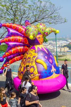 Nesher, Israel - March 22, 2019: People, some in costumes, celebrate the Jewish holyday of Purim in the Adloyada parade, in Nesher, Israel