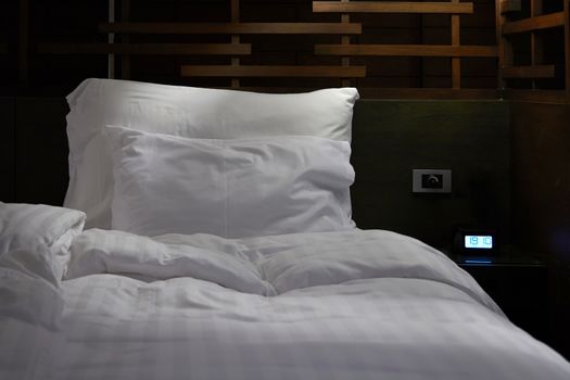 mess bed in hotel room in cleaning and prepare room for customer concept