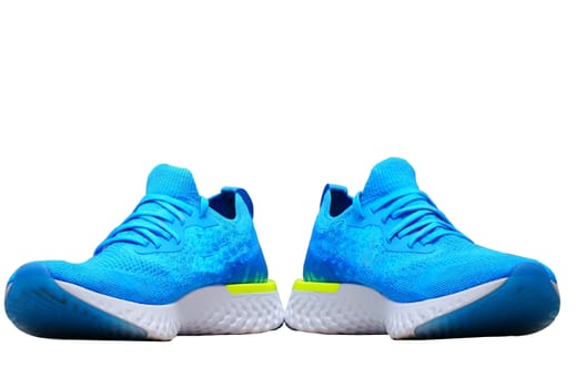 navy blue sport or running shoes for runner on isolated white background