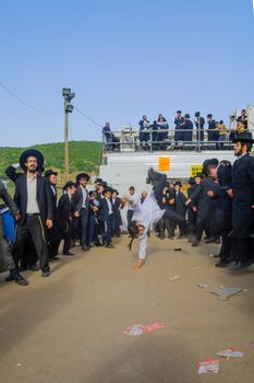 MERON, ISRAEL - MAY 26, 2016: Orthodox Jews dance at the annual hillulah of Rabbi Shimon Bar Yochai, in Meron, Israel, on Lag BaOmer Holiday. This is an annual celebration at the tomb of Rabbi Shimon