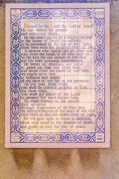 JERUSALEM, ISRAEL - OCTOBER 26, 2017: Prayer text in the yard of the Church of the Nativity of St John the Baptist (St John in the mountains), in the old village of Ein Karem, in Jerusalem, Israel