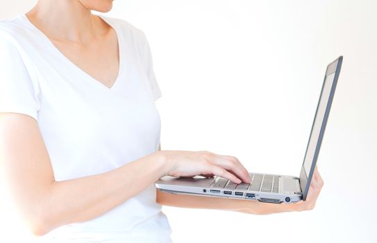 male hand holding a laptop, isolated on white