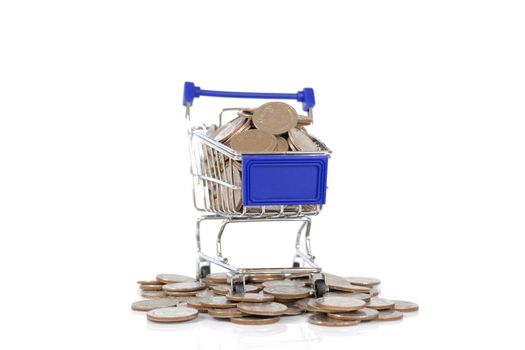 Mini shopping cart with coins on white background