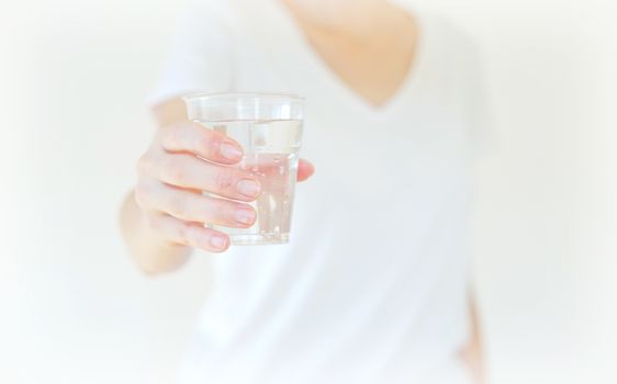 Healthy Young Woman with glass of fresh Water