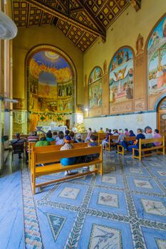 JERUSALEM, ISRAEL - OCTOBER 26, 2017: Pilgrims pray in the Church of the Visitation, in the old village of Ein Karem, in Jerusalem, Israel