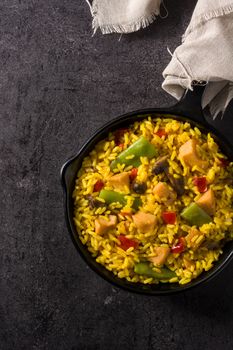 Fried rice with chicken and vegetables on frying iron pan