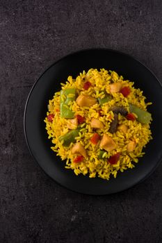 Fried rice with chicken and vegetables on frying iron pan