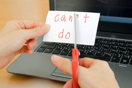 holds card with text can't do on computer