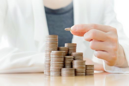 Young Happy Businesswoman Putting Coin 