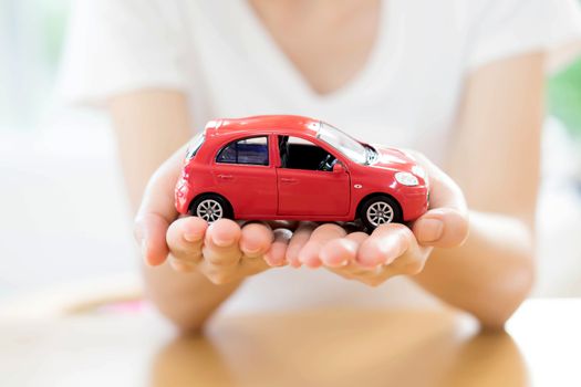 Hand with car. Auto dealership and rental concept background.