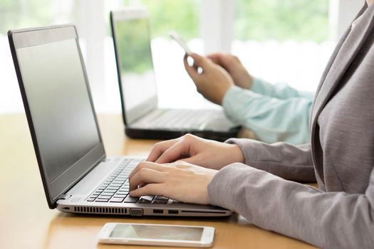 Workers At Desks In Busy Creative Office