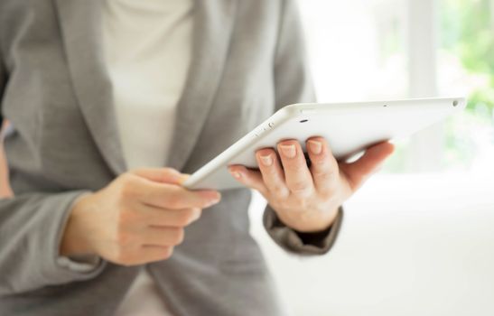 Businesswoman holding tablet in hands