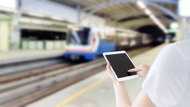 Hand are holding and touch Smartphone with sky train background