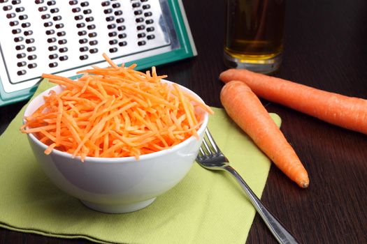 Julienne carrots in white bowl