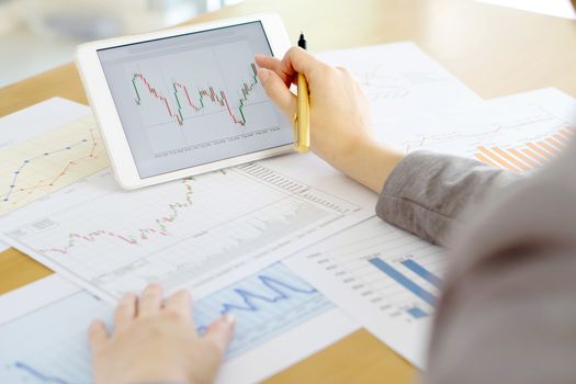 Close-up Of Businesswoman With Digital Tablet And Document