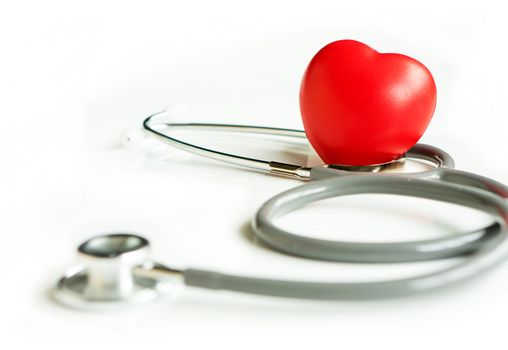 A heart with a stethoscope lying