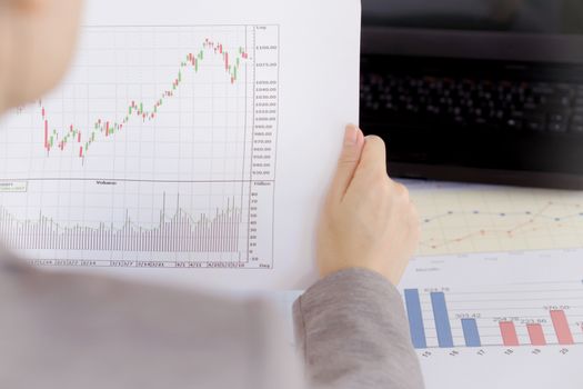 Businesswoman Looking At Financial Report