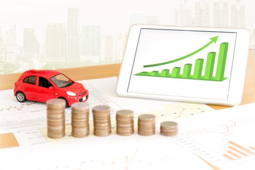 Photo of document some graphics with calculator and car and money