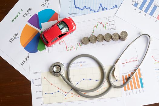 stethoscope car graph and coin
