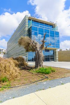 TEL-AVIV, ISRAEL - MAY 27, 2016: View of the Peres Peace House, with locals and visitors, in the southern coast of Jaffa, Now part of Tel-Aviv Yafo, Israel