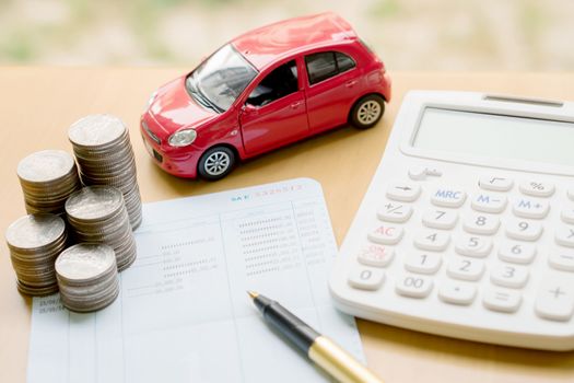 money, pile coin with account book and car, concept