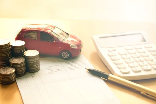 Coins stack in columns, saving book, car. Finance and banking concept.