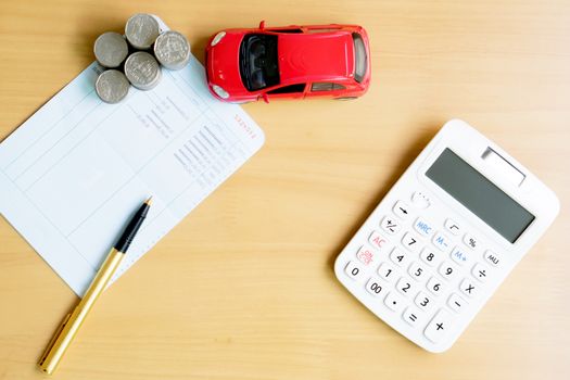 Coins stack in columns, saving book, car. Finance and banking concept.