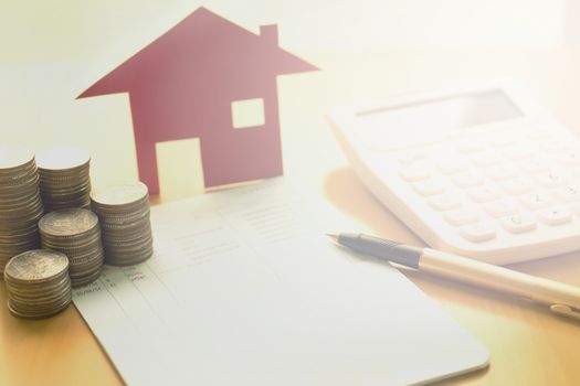 money, pile coin with saving book and paper home,concept