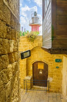 TEL-AVIV, ISRAEL - MAY 27, 2016: An alley and a lighthouse in the old city of Jaffa, Now part of Tel-Aviv Yafo, Israel